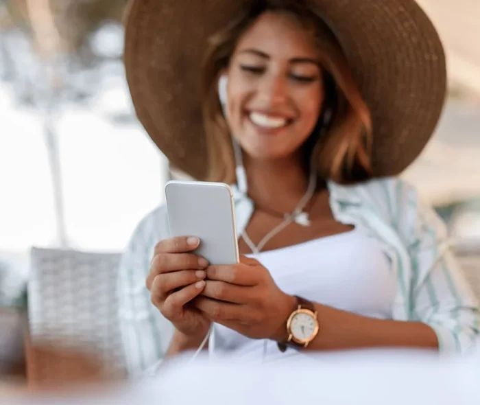 Happy Woman Messaging From Her Mobile Phone - PayPulse